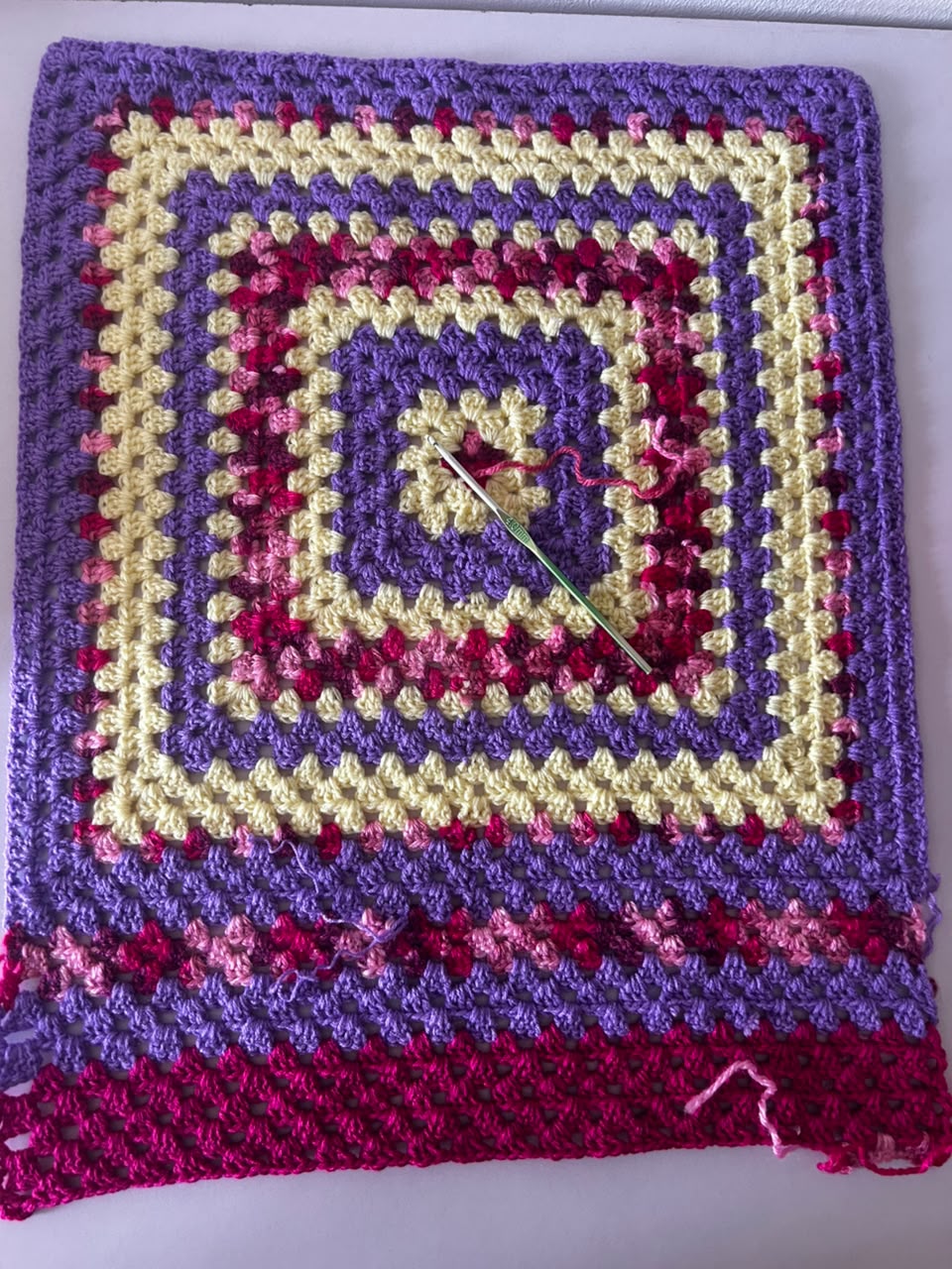 Multi-color granny square crochet piece